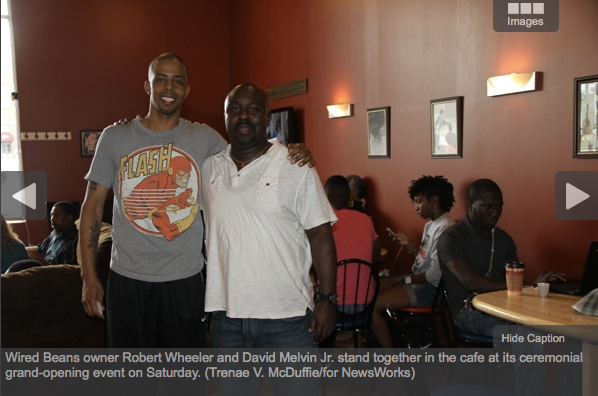 Wired Beans owner Robert Wheeler and David Melvin Jr. stand together in the cafe. Trenae V. McDuffie/for NewsWorks