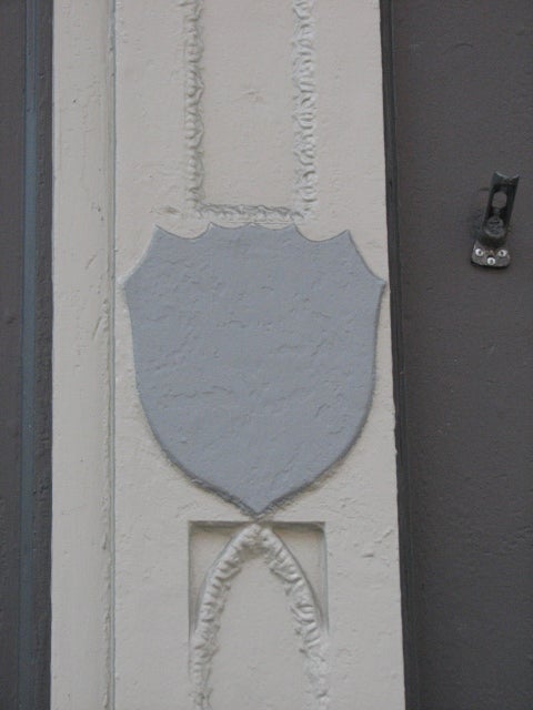 Shields that probably bore the St. Charles name are still found on the first-floor columns.