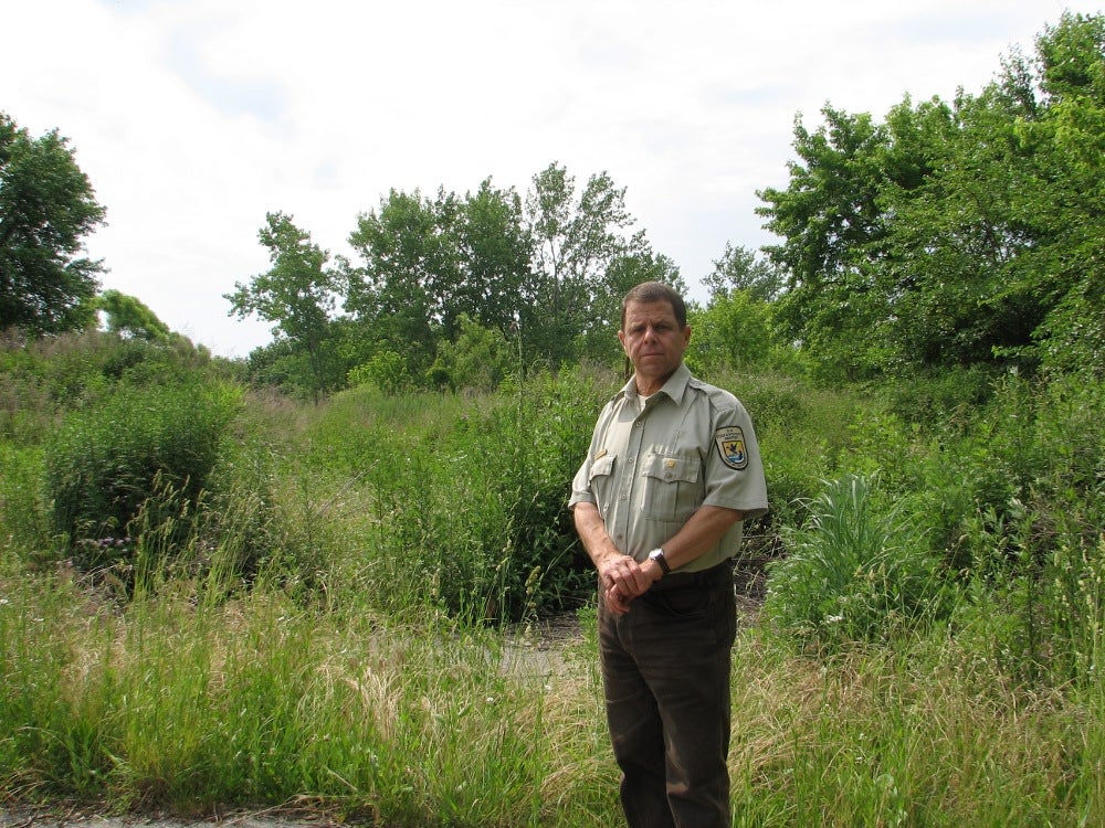 Heinz Refuge Manager Gary Stoltz standing on the end of Lindbergh Boulevard