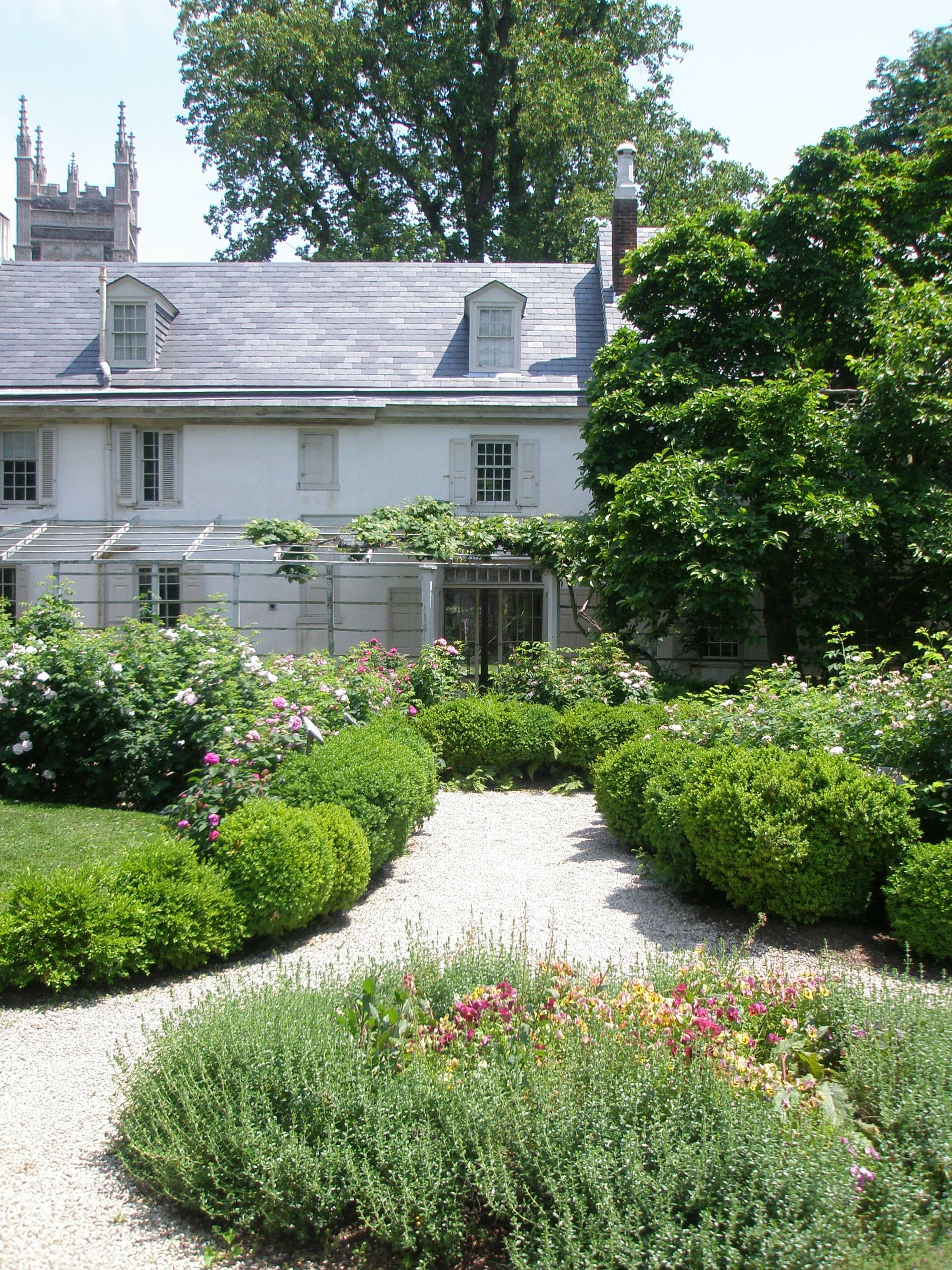 The house is surrounded by beautifully designed gardens and a working farm.