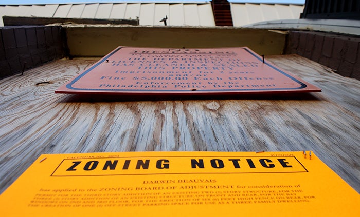 Notice of a ZBA hearing posted to a vacant house in Point Breeze