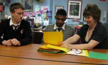 Ryan Director of Admissions Pam McPeak discusses the school's shadow program with students, junior Christopher Gatton (left) and freshman Julio Polanco (center). 