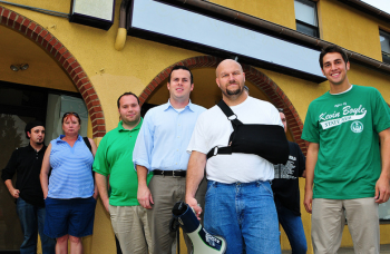 Milt Martelack (megaphone), seen here with State Rep. Kevin Boyle (second from right) and staff members at a September rally against a Holmesburg methadone clinic, will help restart the Mayfair Town W