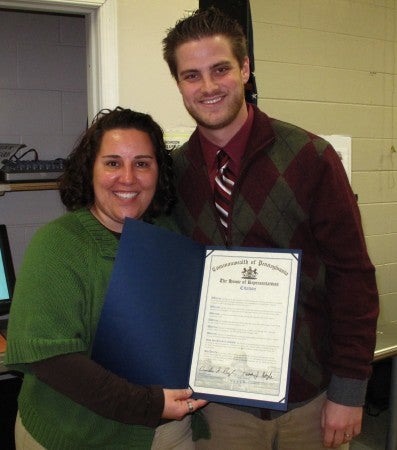 Klein JCC's Lisa Sandler accepts a citation from Seth Kaplan, chief of staff for Rep. Kevin Boyle. Photo/Klein JCC