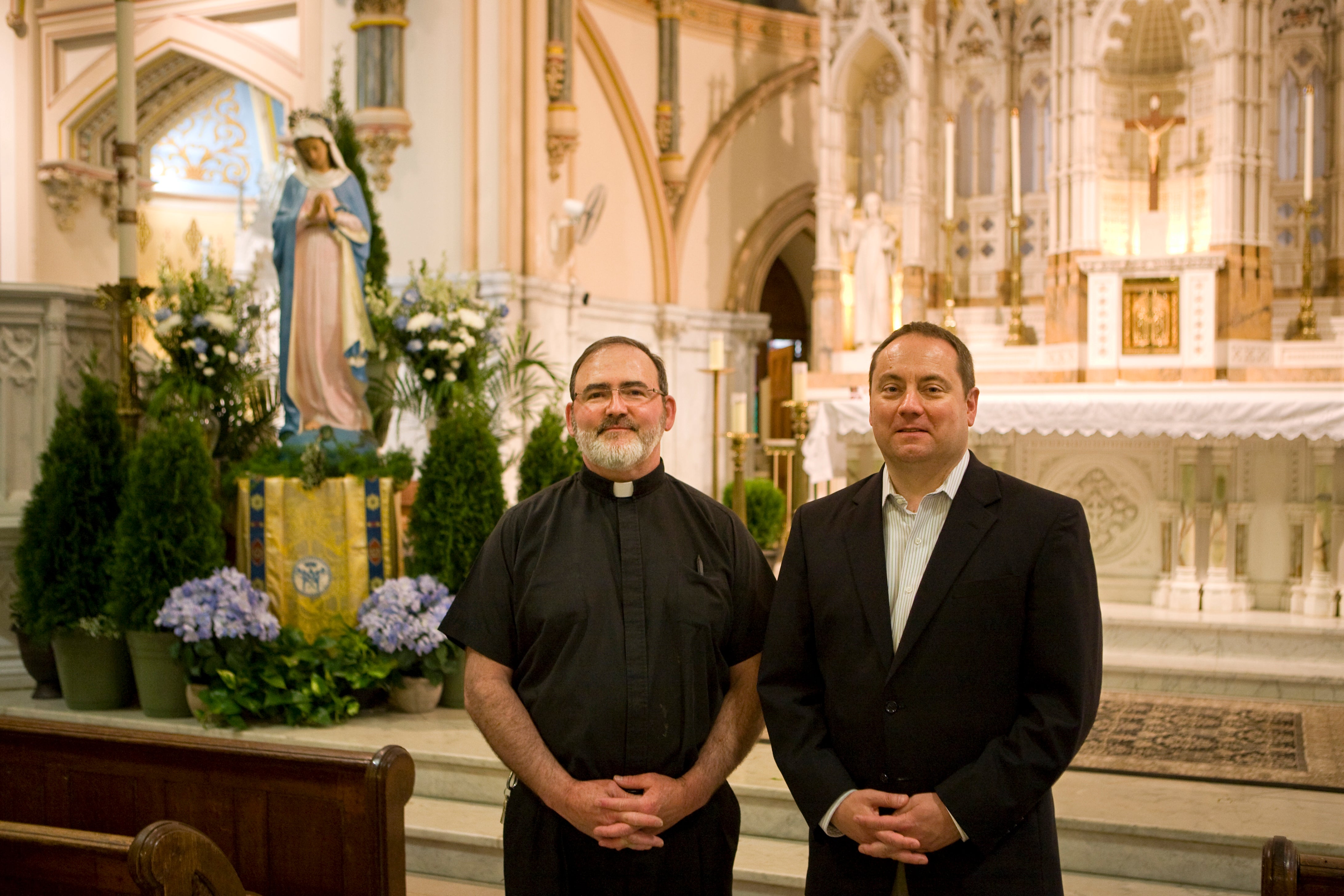 Father Kevin Lawrence (left) and Rich Van Fossen in the sanctuary of Saint John the Baptist, 2015 | Credit: Bradley Maule