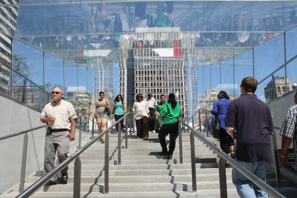 Glass headhouses provide an airy transition from transit to the plaza above