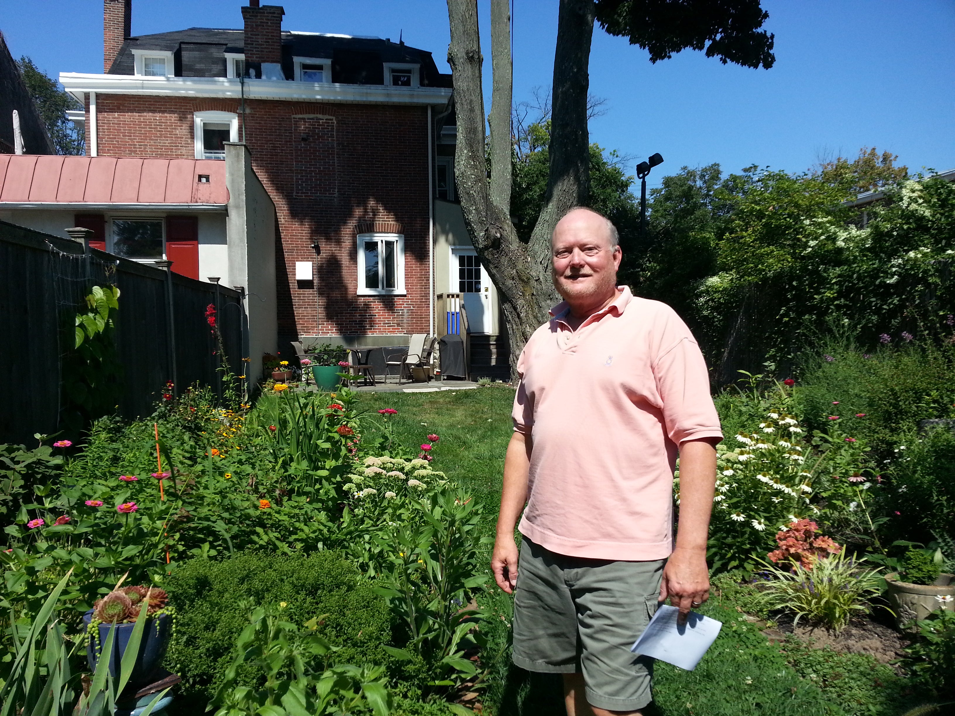 Richard Redding in the garden he plans and his wife plants.