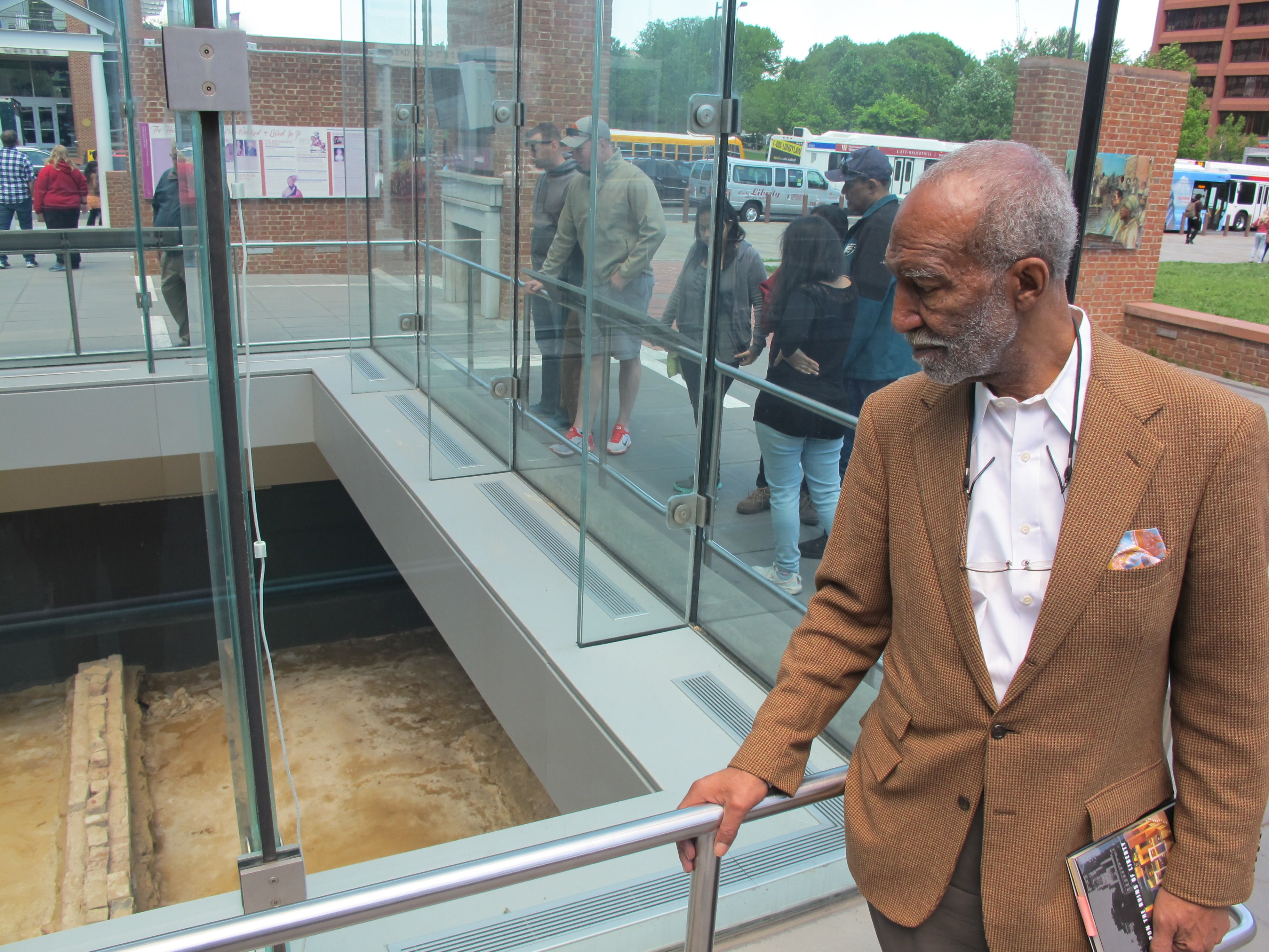 Emmanuel Kelly looking at the foundations of the President's House.