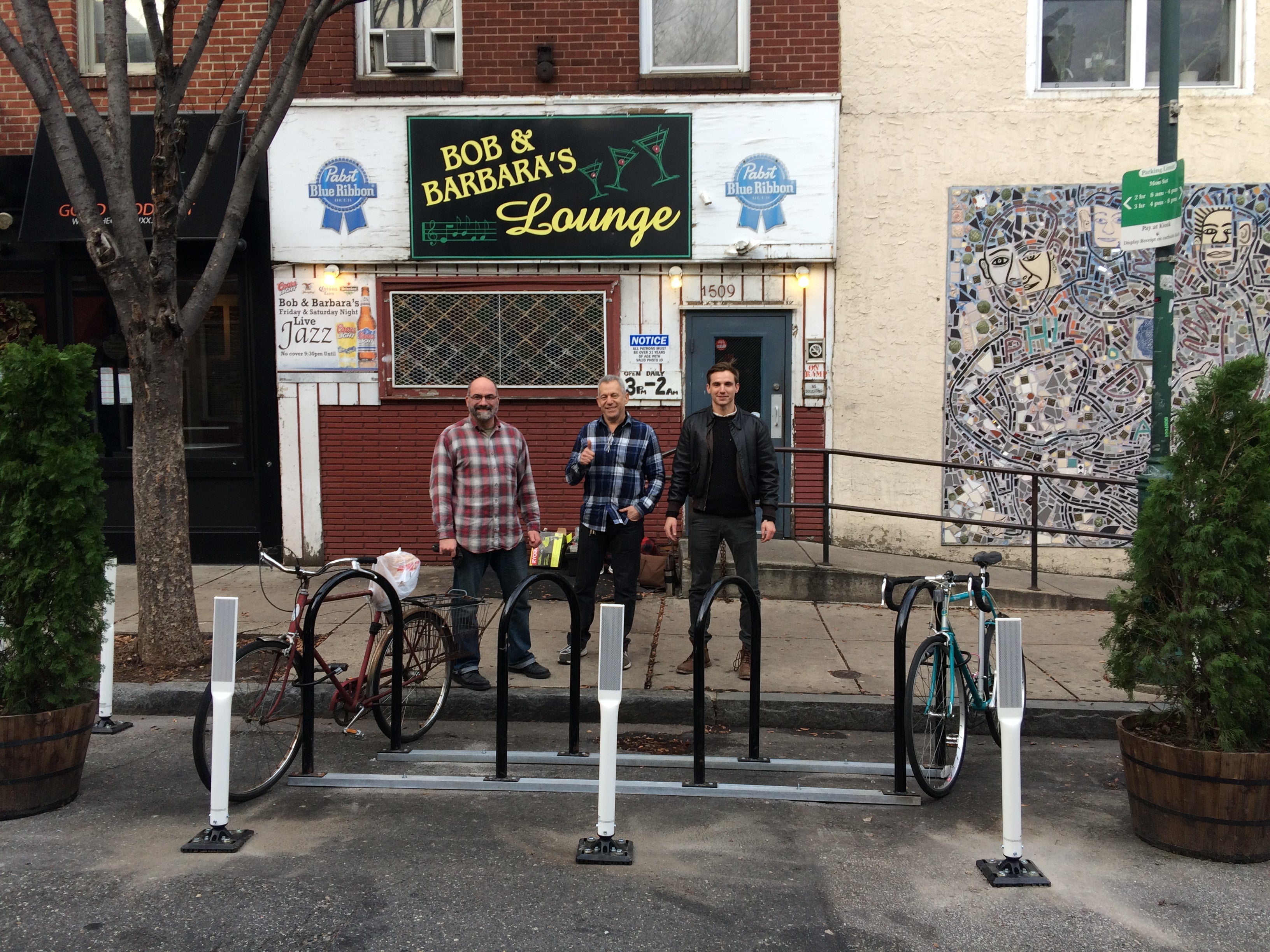 Install team poses with newly installed bike corral in front of Bob & Barbara's (from L to R): Marcus Ferreria, Jack Prince, Steve Cobb 