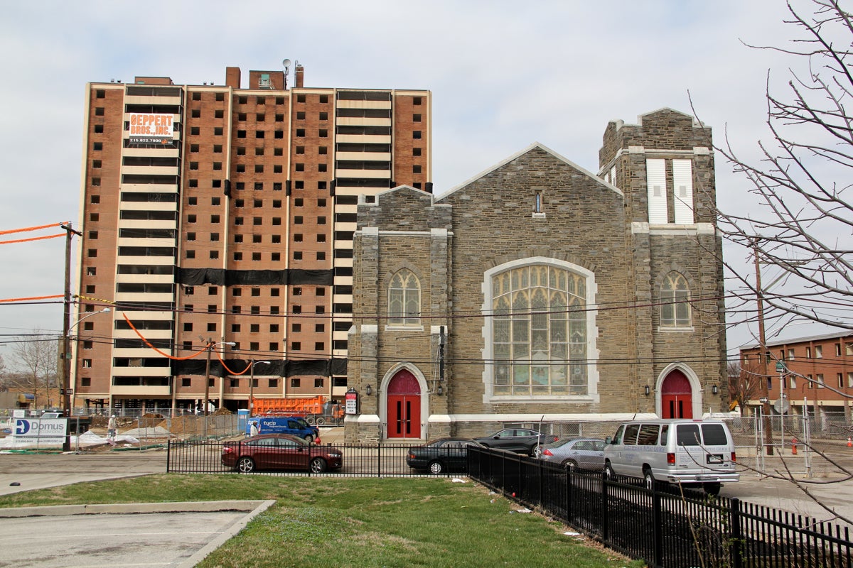 Miller Memorial Baptist Church, Norman Blumberg Apartments loom behind, March 16, 2016 | Emma Lee/WHYY