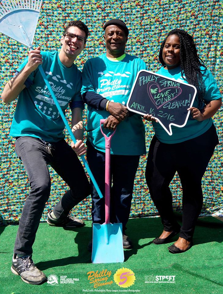 Philip Green (left) and Stephanie Michel, North 5th Street Revitalization Project co-directors, with project sidewalk cleaner Warren at this year's spring cleanup. (Courtesy of Green)