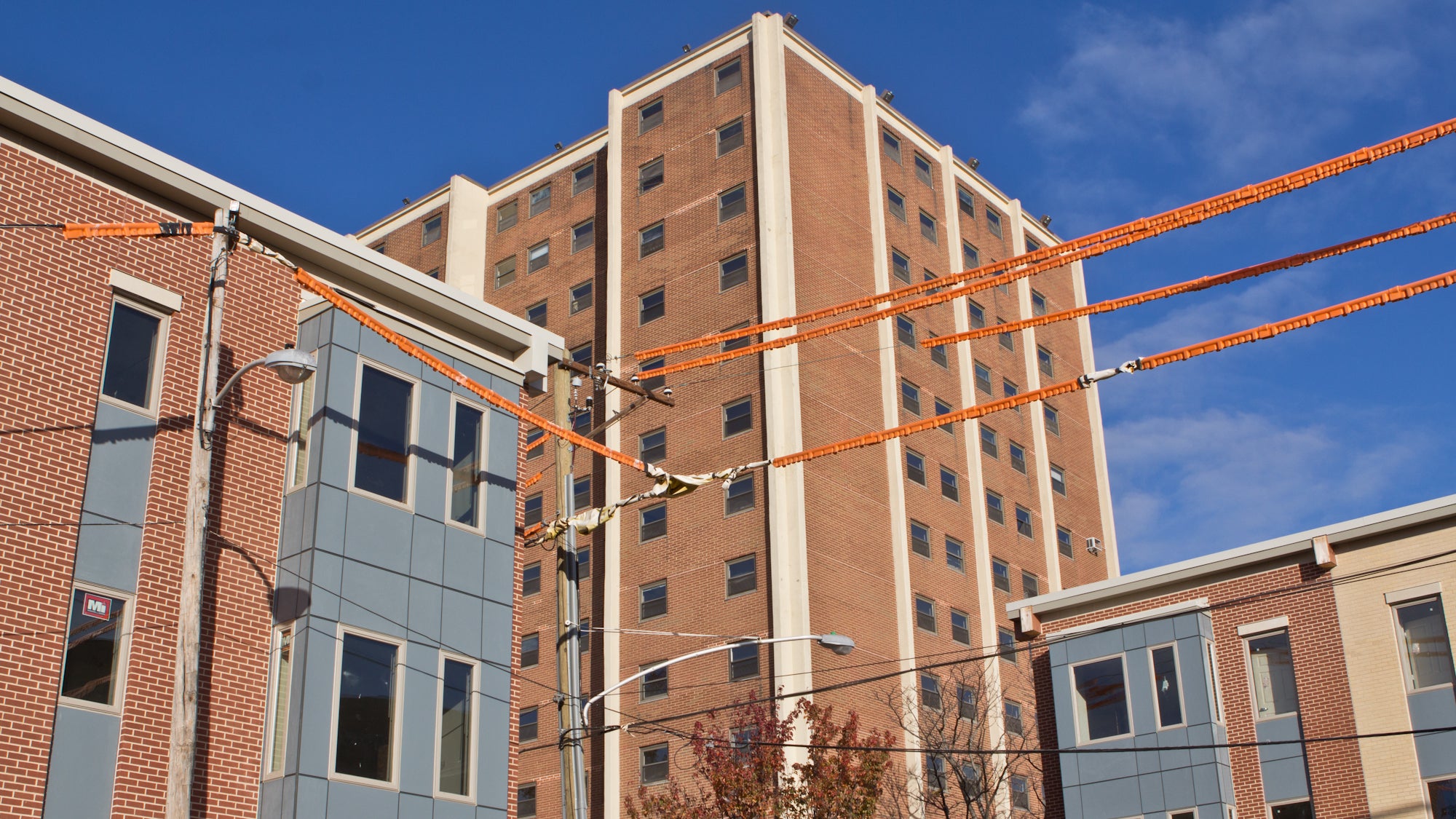 New townhouse-style units cohabitate with the old Senior Tower on the Norman Blumberg Apartments site, November 2016 | Kimberly Paynter / WHYY