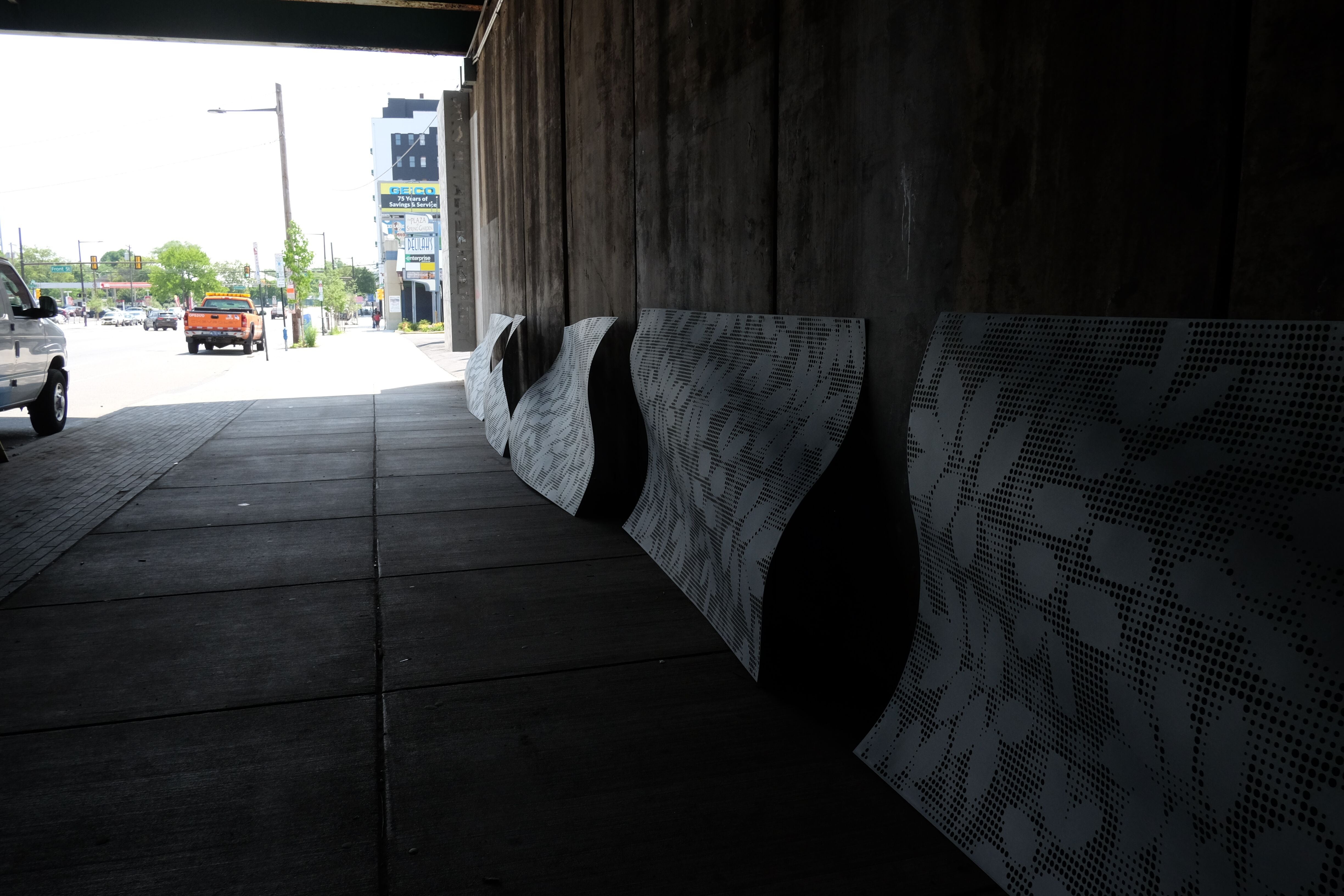 Spring Garden Connector: Panels suspended from the underpass roof wave.