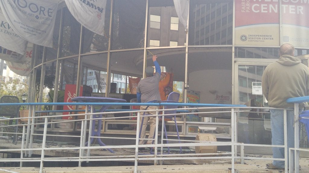 Workers begin to secure and repair Fairmount Park Welcome Center after overnight fire, October 27 | Tom MacDonald / WHYY