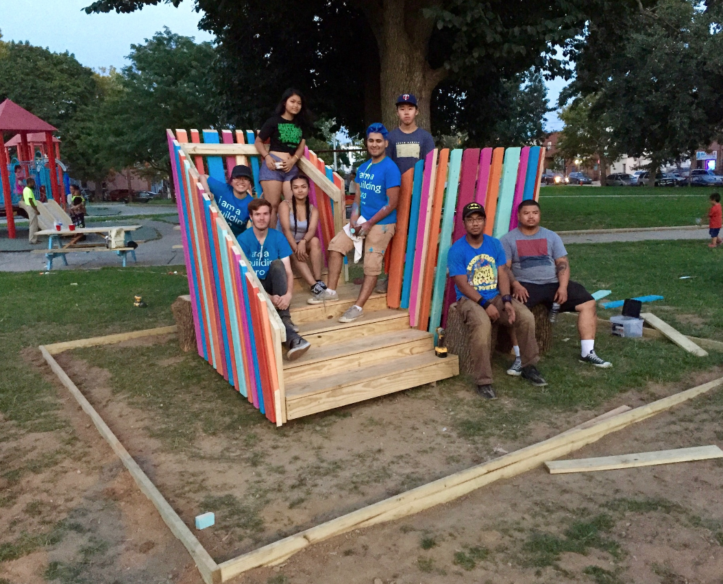 Building Heroes pose on super seats they built for Mifflin Park through a NEA-funded Tiny WPA program.
