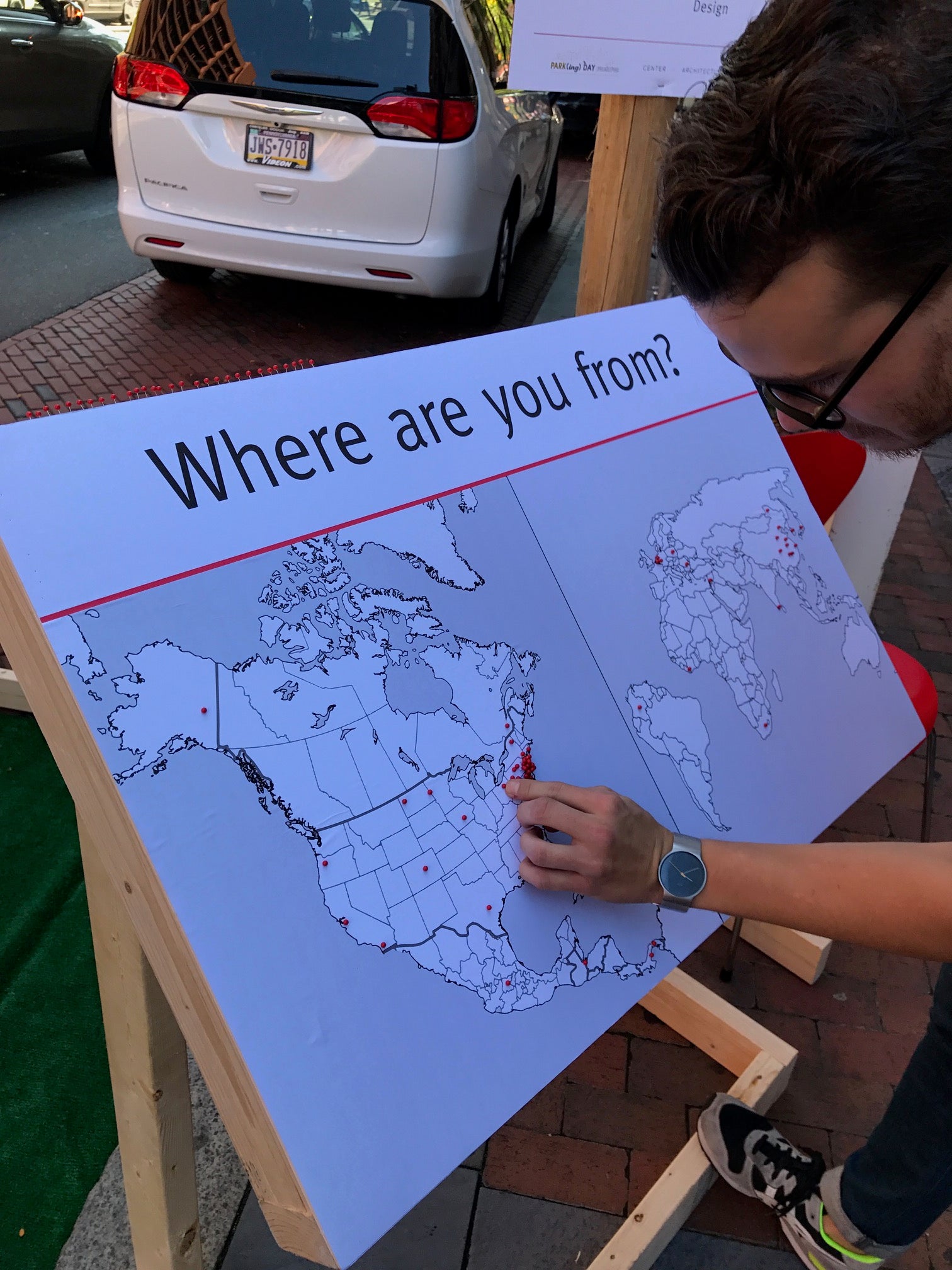 Joe Thomas interacts with Cloud Gehshan Placemaking's Where are you from? at Market and 4th on Park(ing) Day 2017