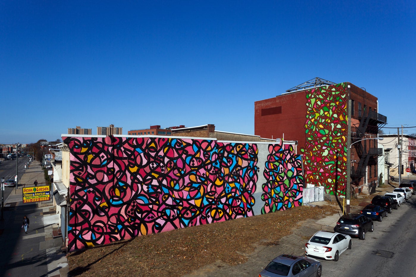 eL Seed mural at Market and Preston streets in West Philadelphia. Credit: Steve Weinik.