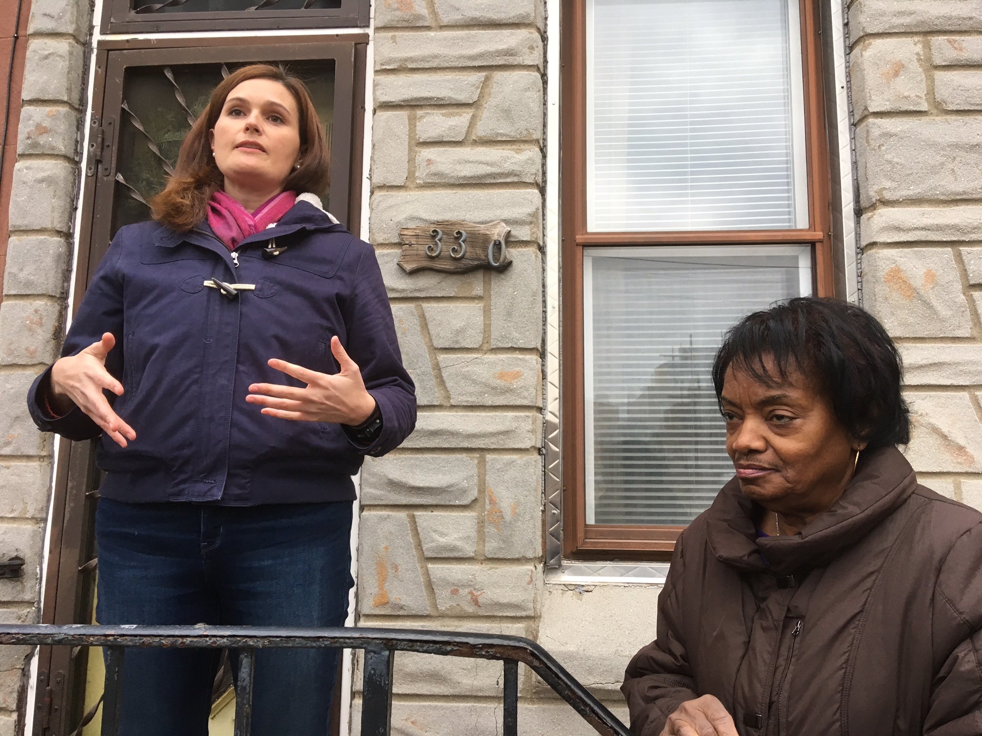 Garnet Street resident Alison Stohr introduces Betty Beaufort during a rally in front of Beaufort's home