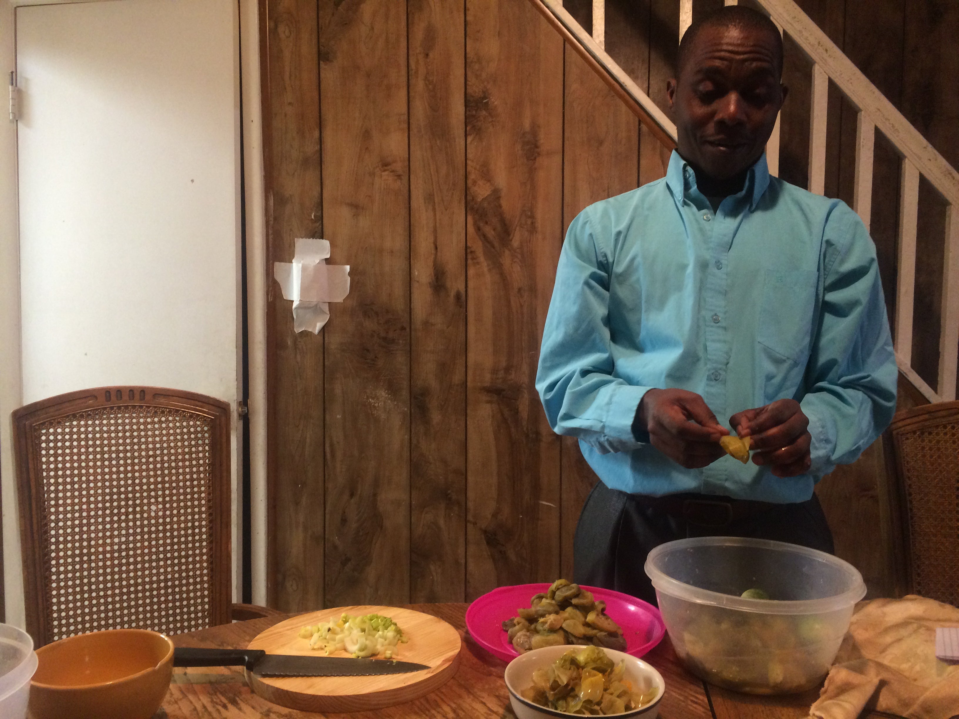 Merthus Mbonigaba prepares African eggplant for Sunday dinner. | Catalina Jaramillo / WHYY