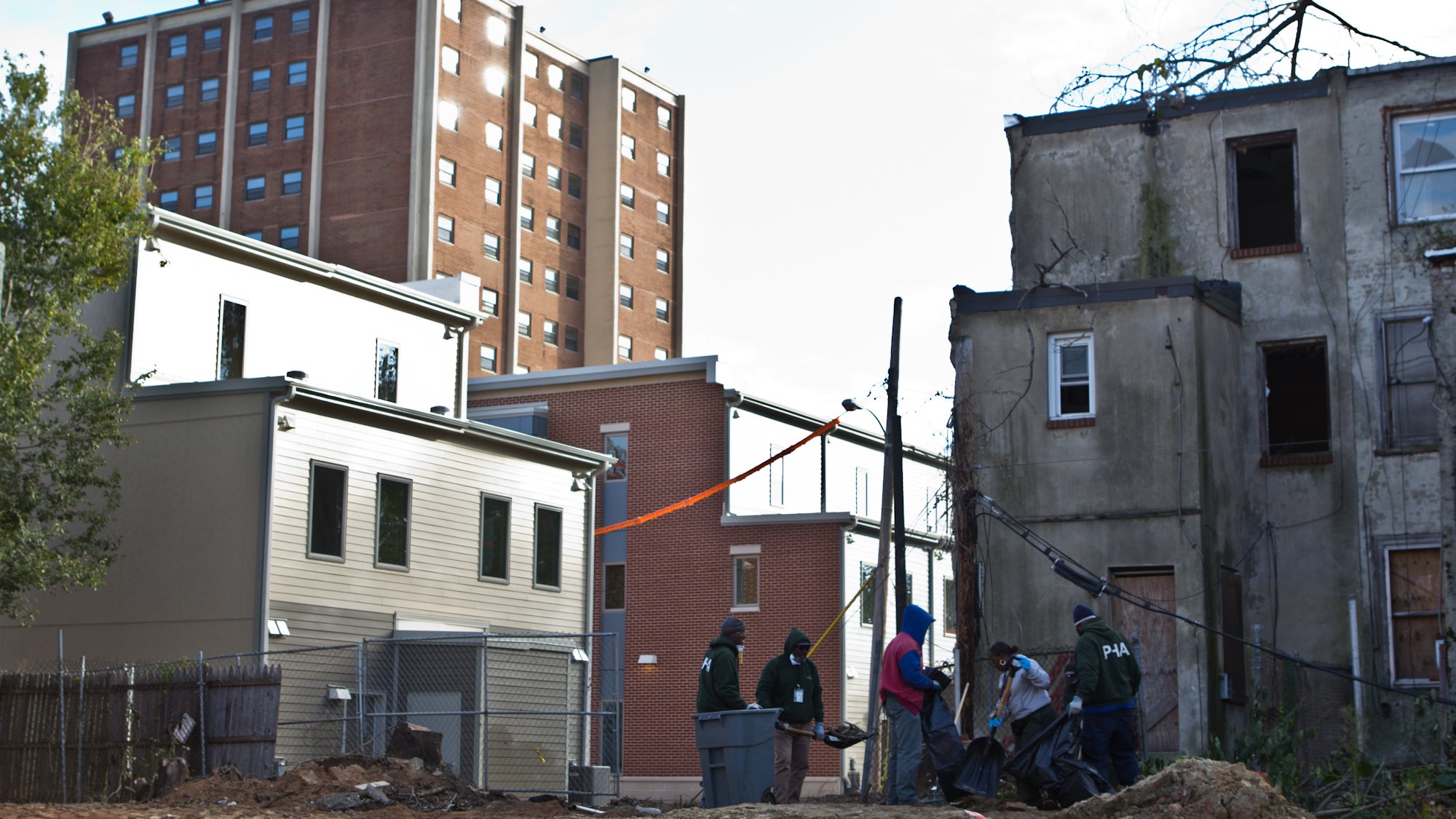 Rebuilding Sharswood: PHA employees work around the new housing development in Philadelphia’s Sharswood neighborhood. (Kimberly Paynter/WHYY)