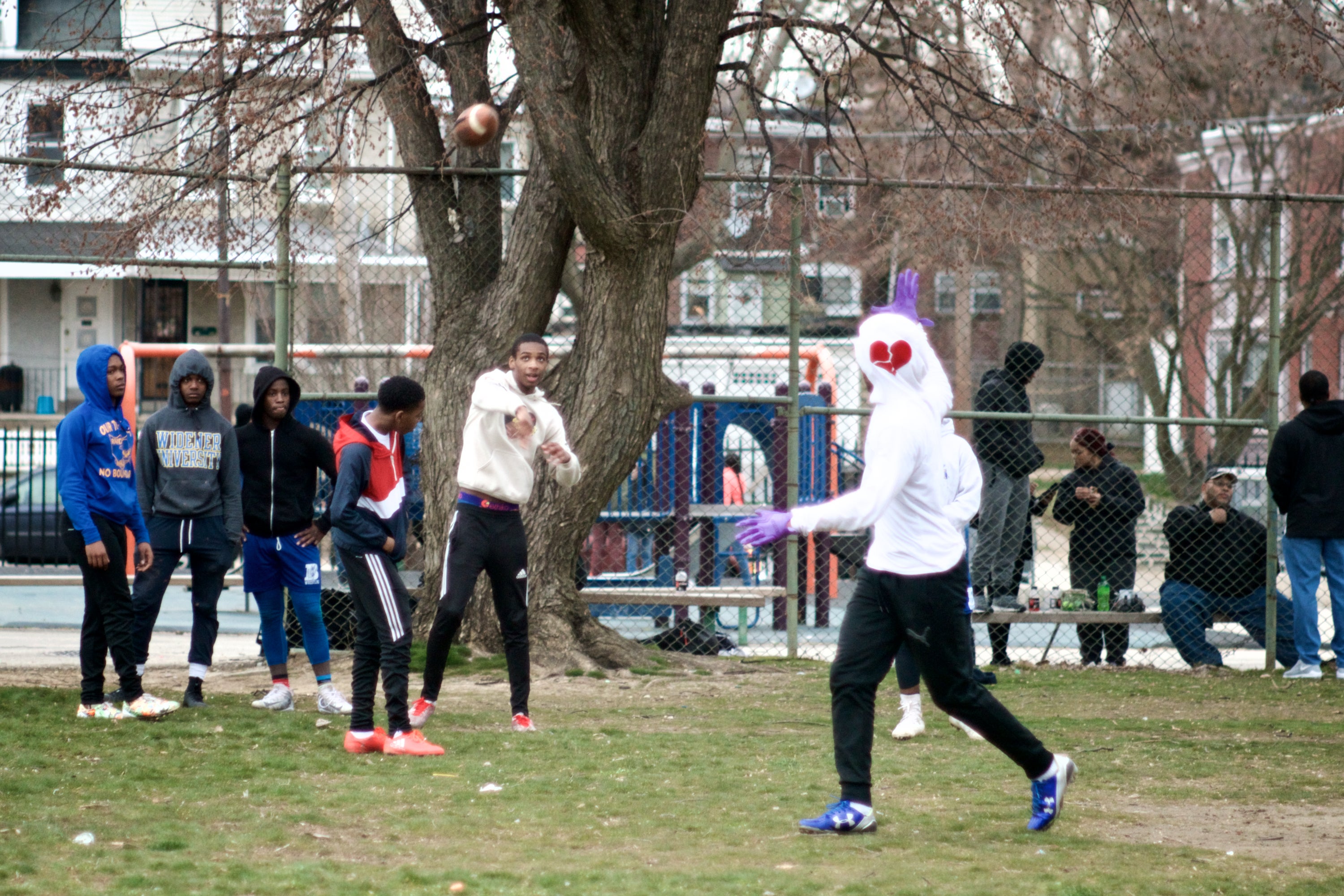 The NW Raiders youth football team practices on a bumpy city-owned training field located behind Lonnie Young Rec. Center in Germantown (Bastiaan Slabbers for WHYY)