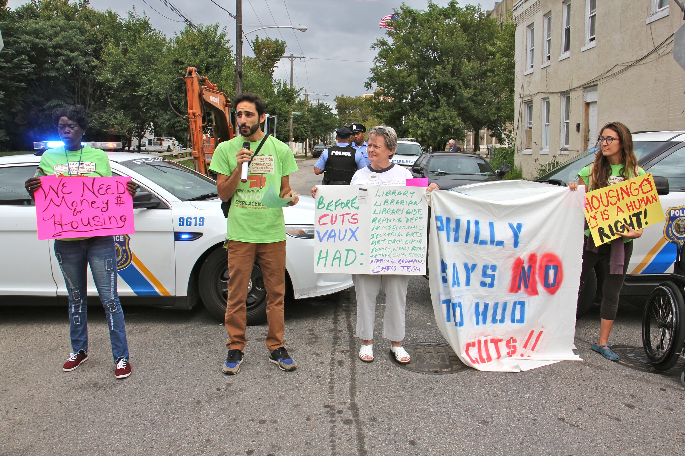 The Philadelphia Coalition for Affordable Communities protests proposed cuts to federal housing grants as HUD Sec. Ben Carson attends opening of Vaux Big Picture High School