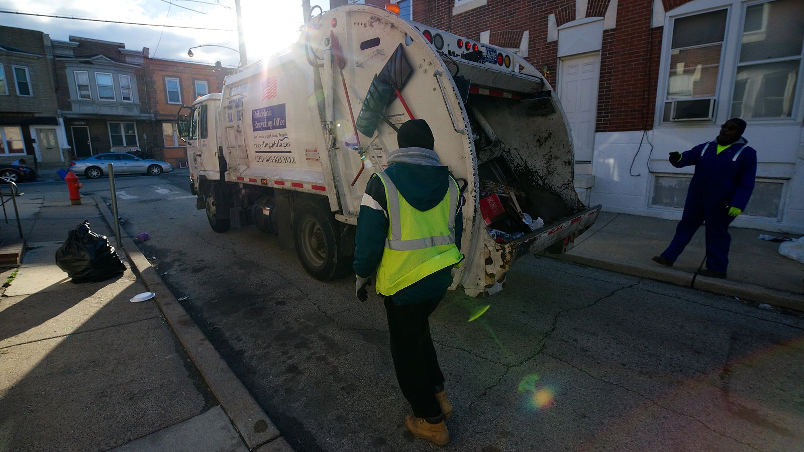 This 9-cubic yard truck needs to be tipped more often but it is small enough to maneuver the tight South Philadelphia Streets. February 13th, 2017. (Bastiaan Slabbers for NewsWorks)