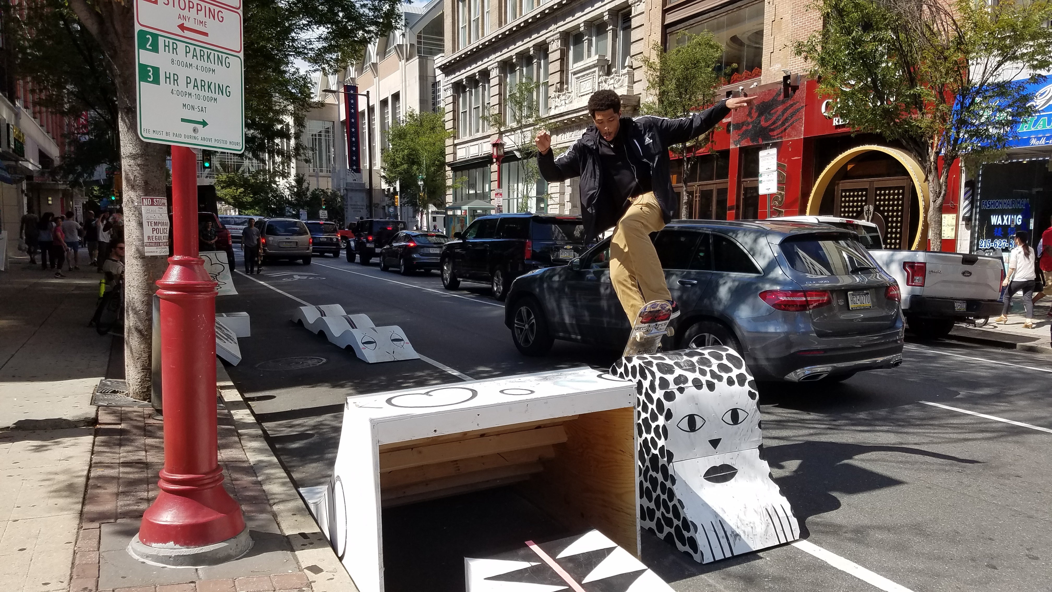 Unknown skater enjoys pop-up skate parklet at Park(ing) Day 2017 on Arch Street near 11th. Designed by James Booney of Space 1026.