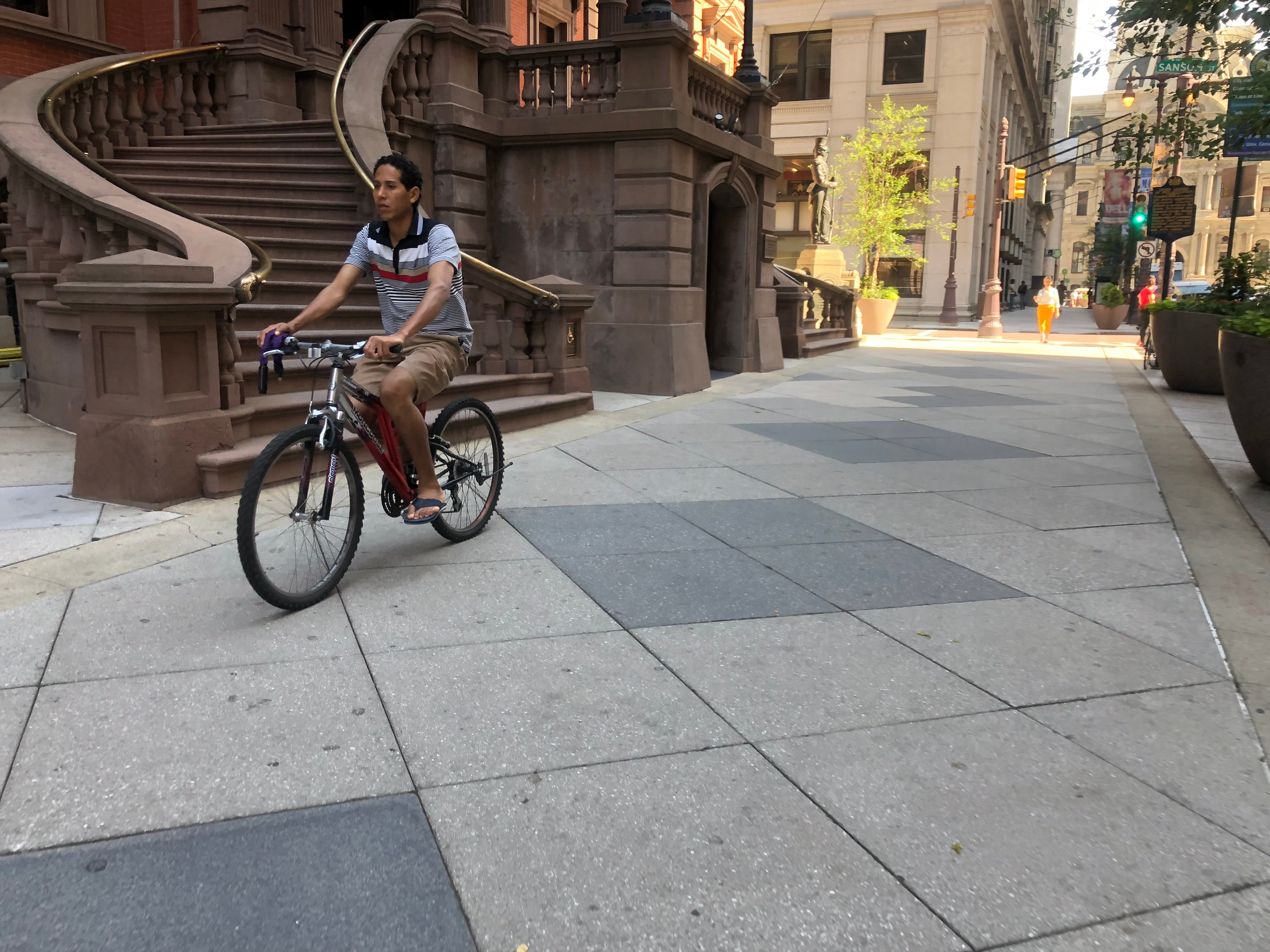 Riding a bike shop on the sidewalk