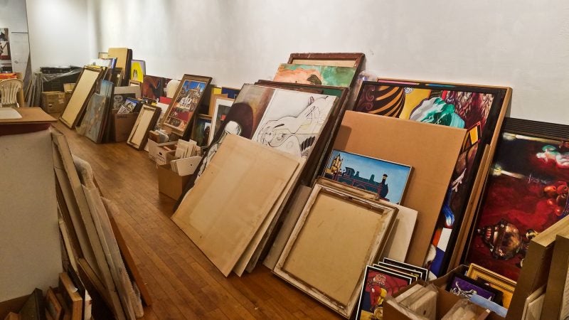 Thousands of pieces of art are sorted on the ground floor of the Rodger LaPelle Galleries building. (Peter Crimmins/WHYY)