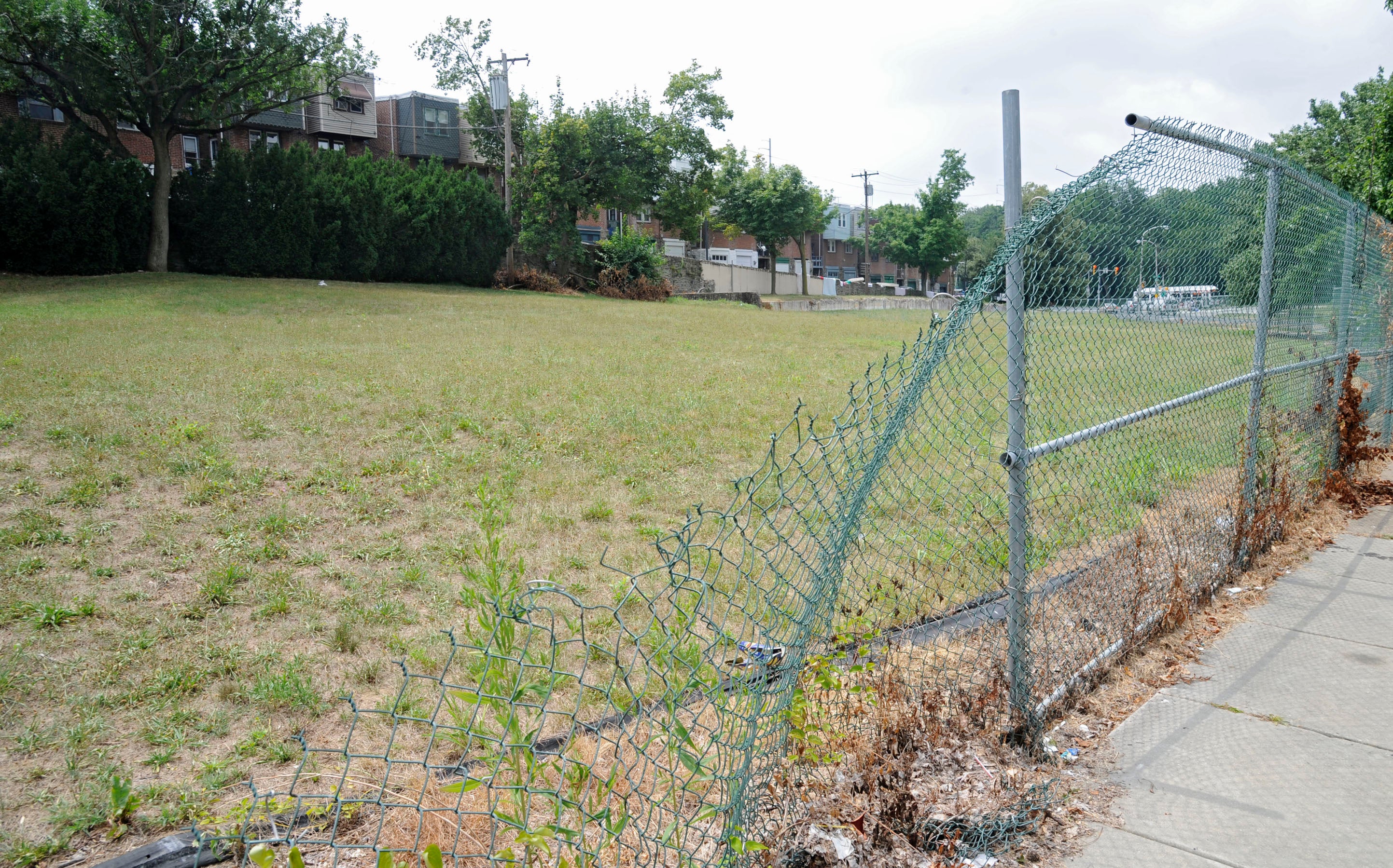 A large empty lot on Cobbs Creek Parkway owned by a bankrupt medical company owes $1.6 million. (Clem Murray / Inquirer)