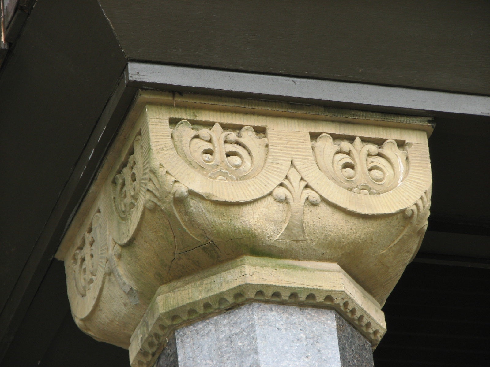 Decorative column capitals distinguish what began as separate houses.
