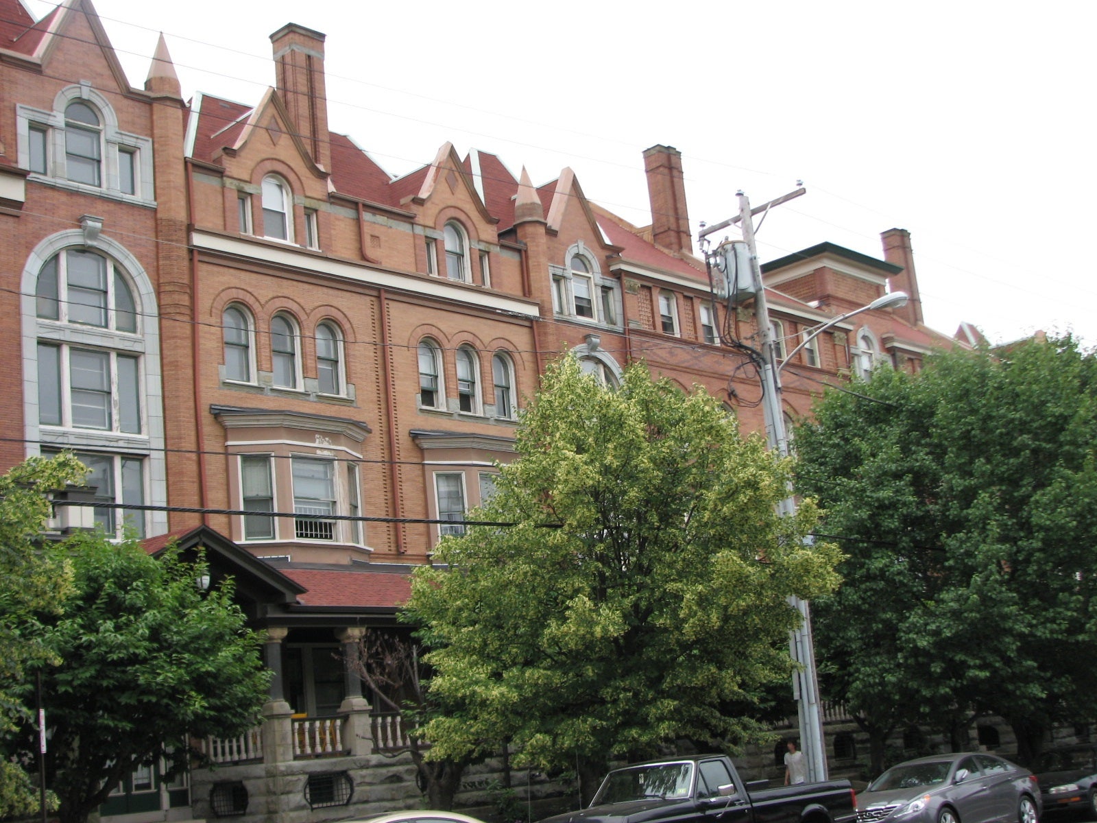 Milligan and Webber filled the space between the houses with stair towers, defined by exterior granite arches.