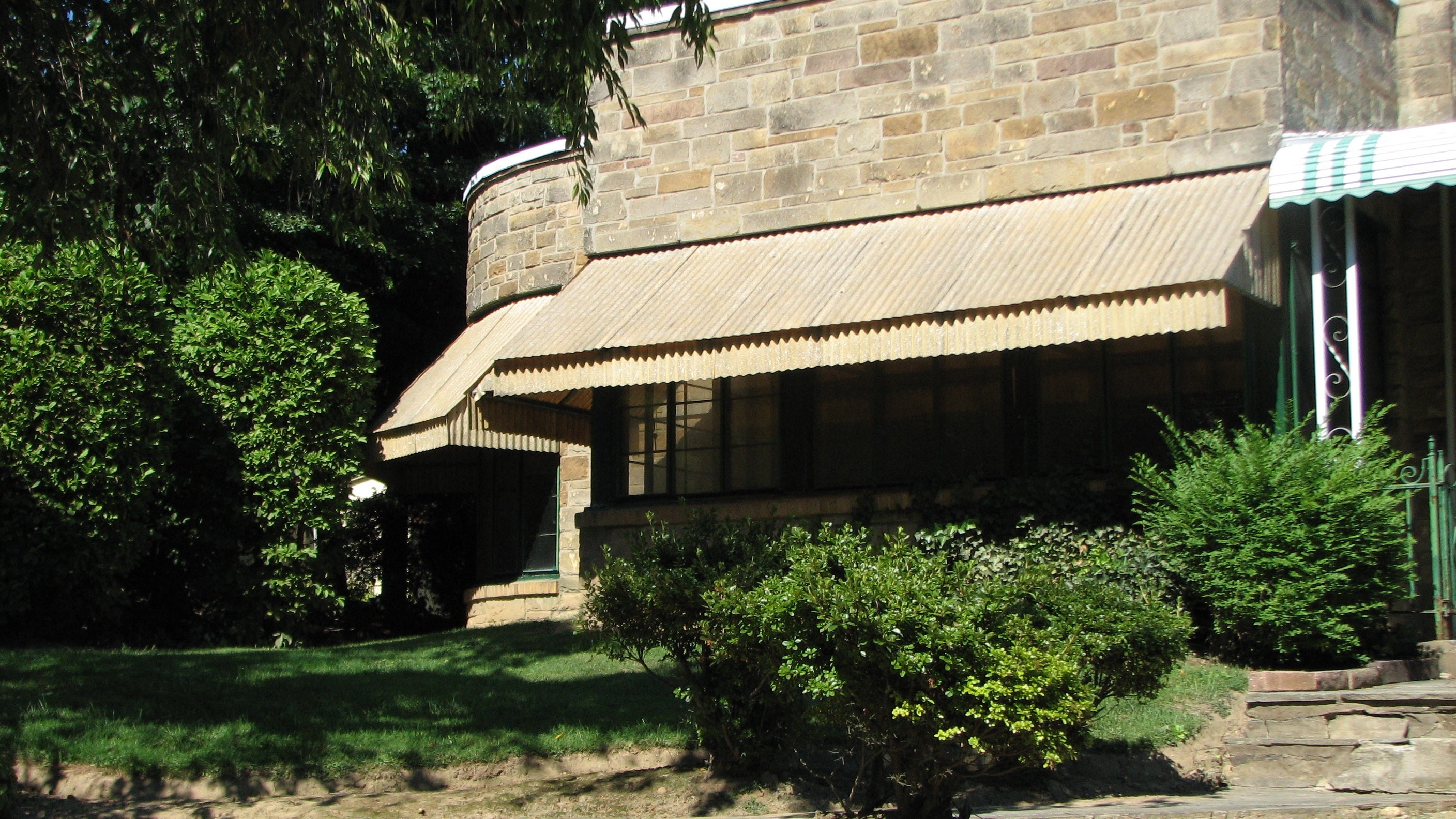 Several homes have been altered with awnings and other additions.