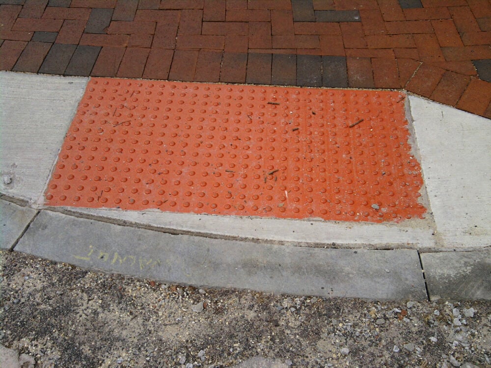 The concrete and bright red insert are the wrong colors