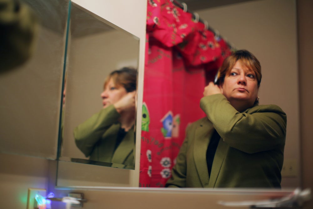 Morales, brushing her hair inside of her Pradera II style townhome which she purchased from APM.