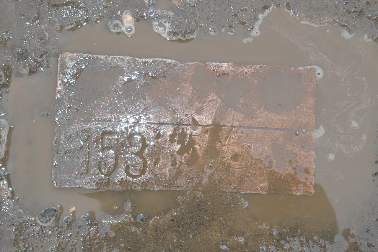 Brass marker at Cramp's dock