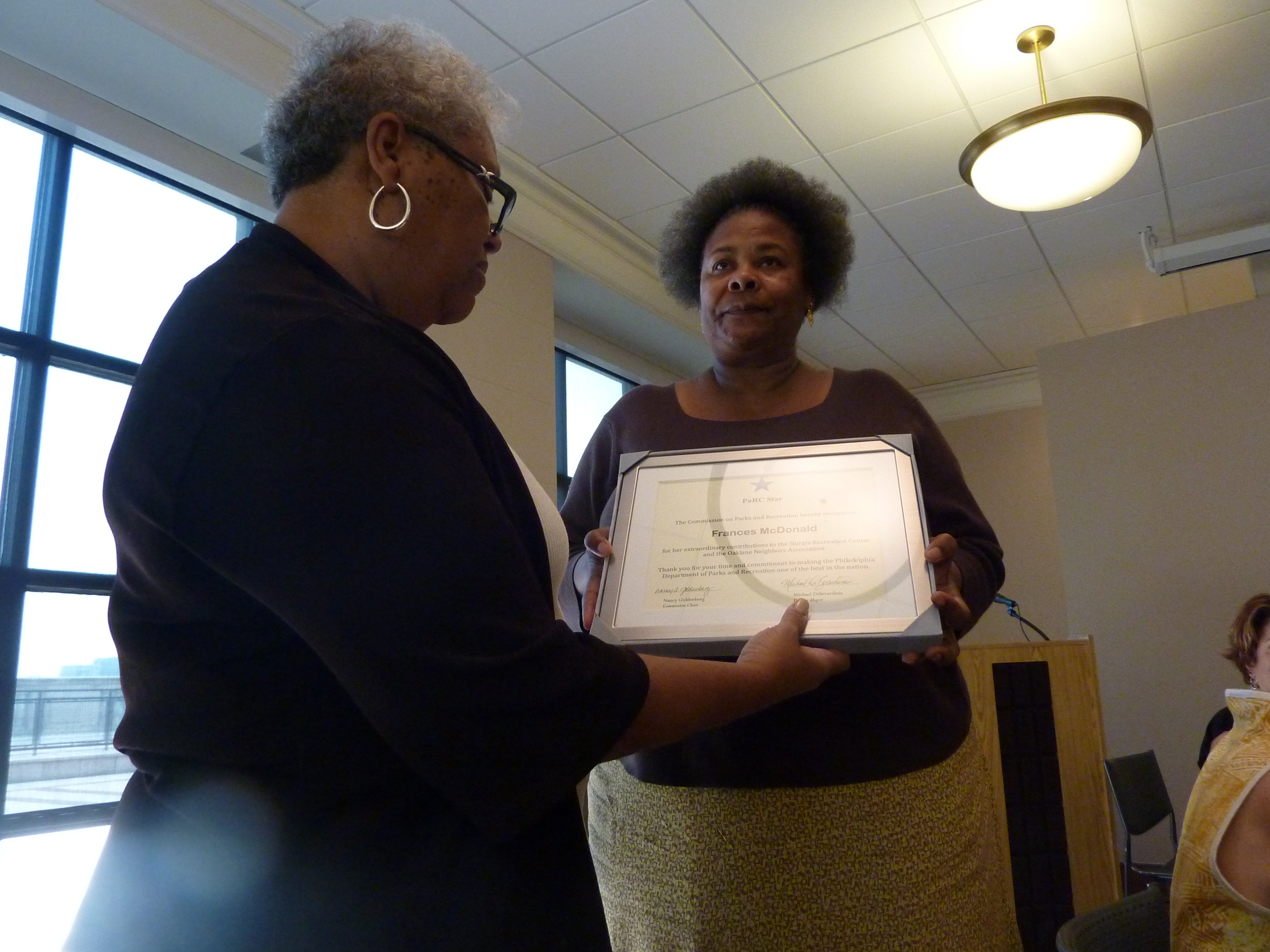 Commissioner Carol Rice presents a PaRC Star award to Frances McDonald