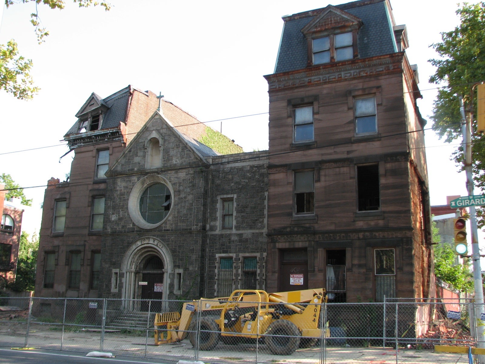 Demolition crews have begun tearing down the two brownstones at 2012-30 West Girard Ave.