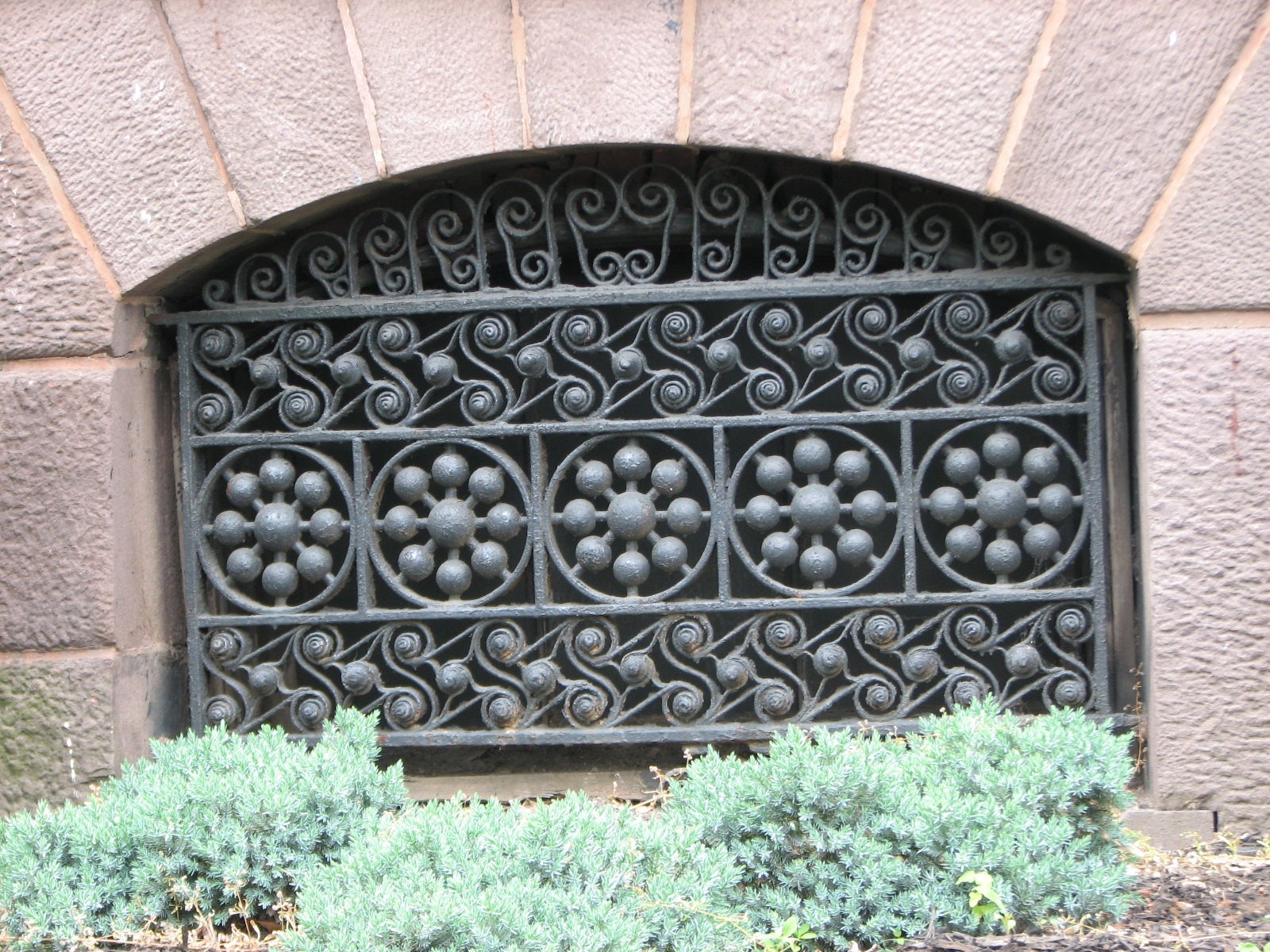 Original ironwork and other details adorn the well-maintained exterior of the house.
