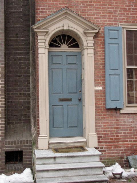 The ornate entrance to a neighboring home.