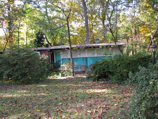 Several houses are painted in bold colors that remain complementary to the landscape.