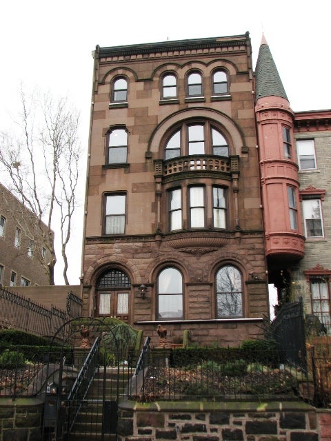A corner tower distinguishes a beautifully maintained Romanesque Revival mansion on the 2200 block.