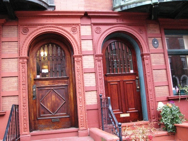 Another pair of twin entrances on the 2100 block feature decorative terra-cotta arches. 