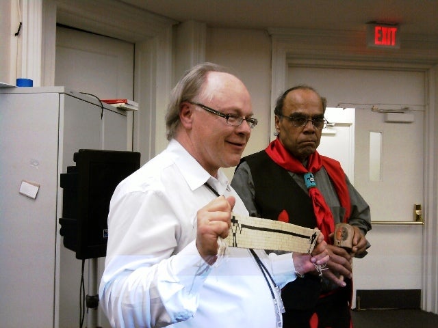 Scholar Gregory Schaaf  and Chief Mark Gould hold a wampum belt