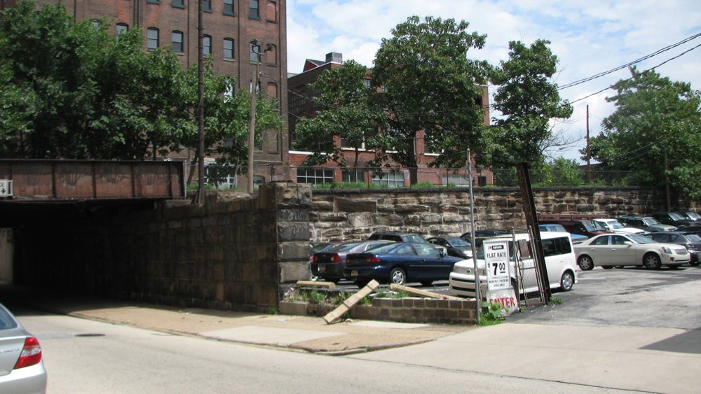 The Viaduct runs past a former coal yard, now a parking lot.