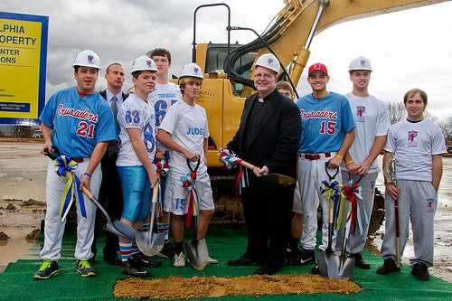 Student athletes at Father Judge High School join President Fr. Joe Campellone and Director of Institutional Advancement Brian Patrick King for the ground breaking. | Photo by Michelle Alton, NEast Ph