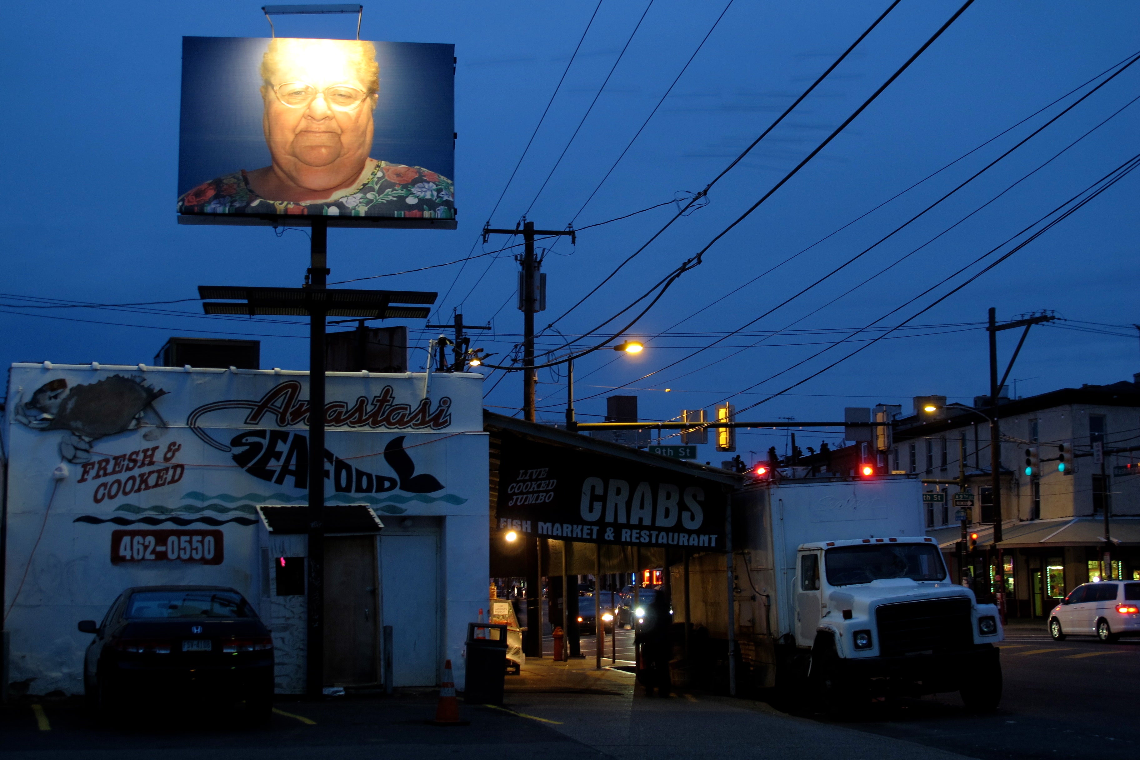 Zoe Strauss' Ms. Antoinette Conti, La Corona / The Crown watching over Washington Avenue.