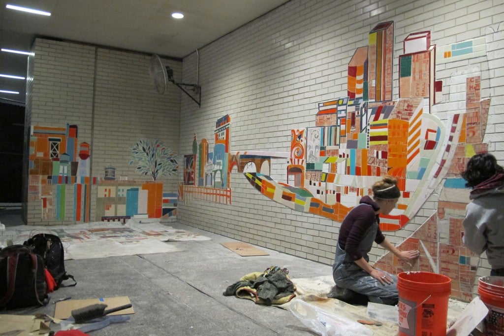 Installation of 'Under the Clothespin' is underway in the Centre Square subway concourse.