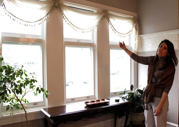 Overbrook Farms Club Board Member Stephanie Kindt presents an original window in her home located on the 6300- block of Overbrook Avenue.